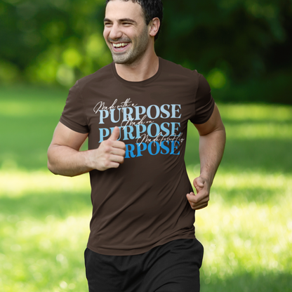 Man running outdoors wearing a brown t-shirt with motivational text