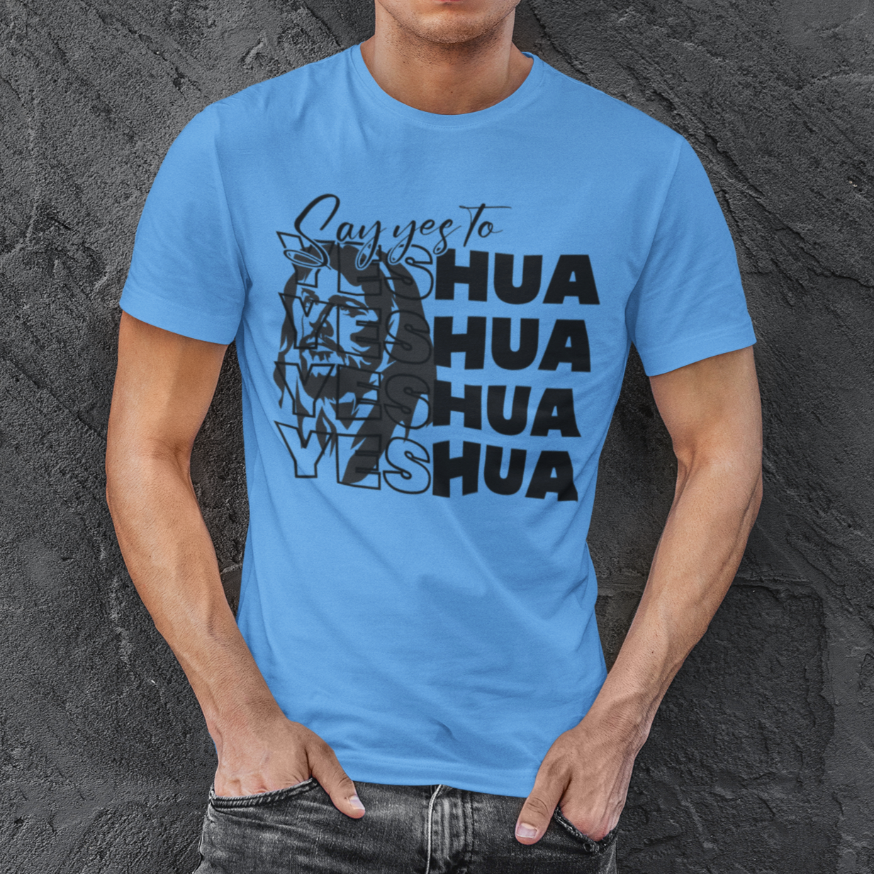 Man wearing a blue t-shirt with a graphic design against a textured gray background