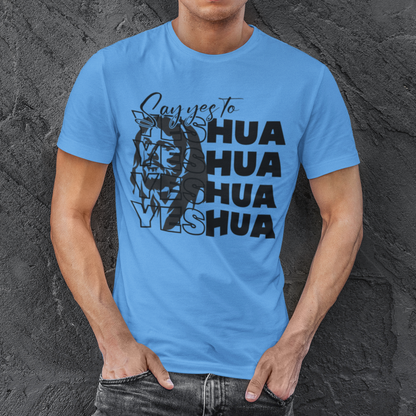 Man wearing a blue t-shirt with a graphic design against a textured gray background