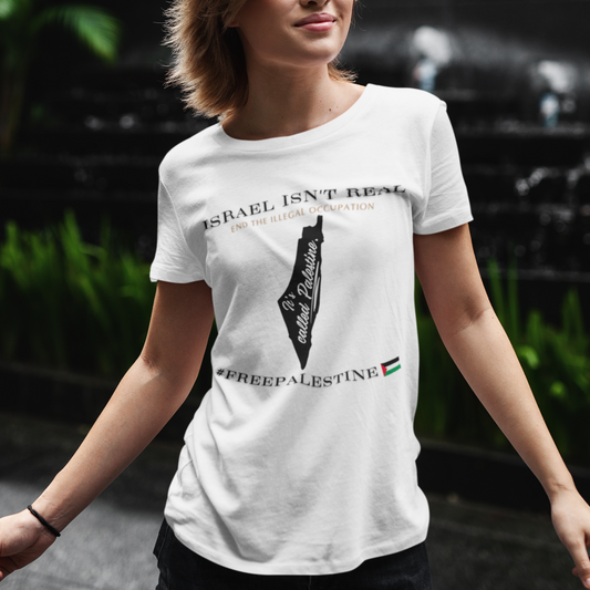 Woman wearing a white t-shirt with a graphic design, standing outdoors.