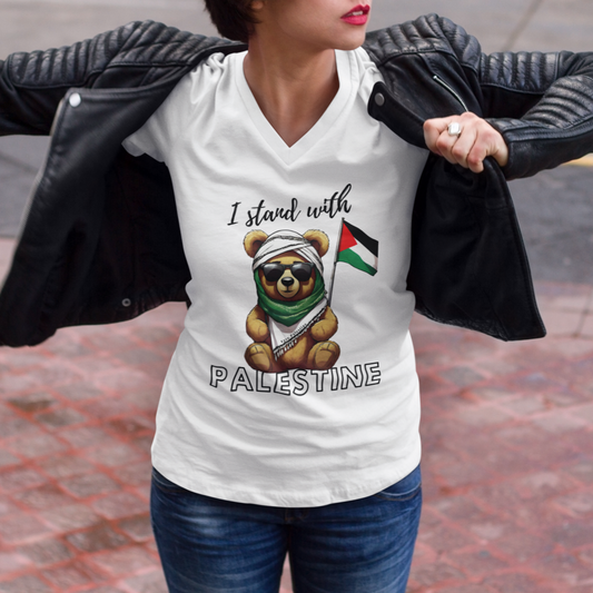 Person wearing a white t-shirt with a bear holding a Palestinian flag design and 'I stand with Palestine' text.